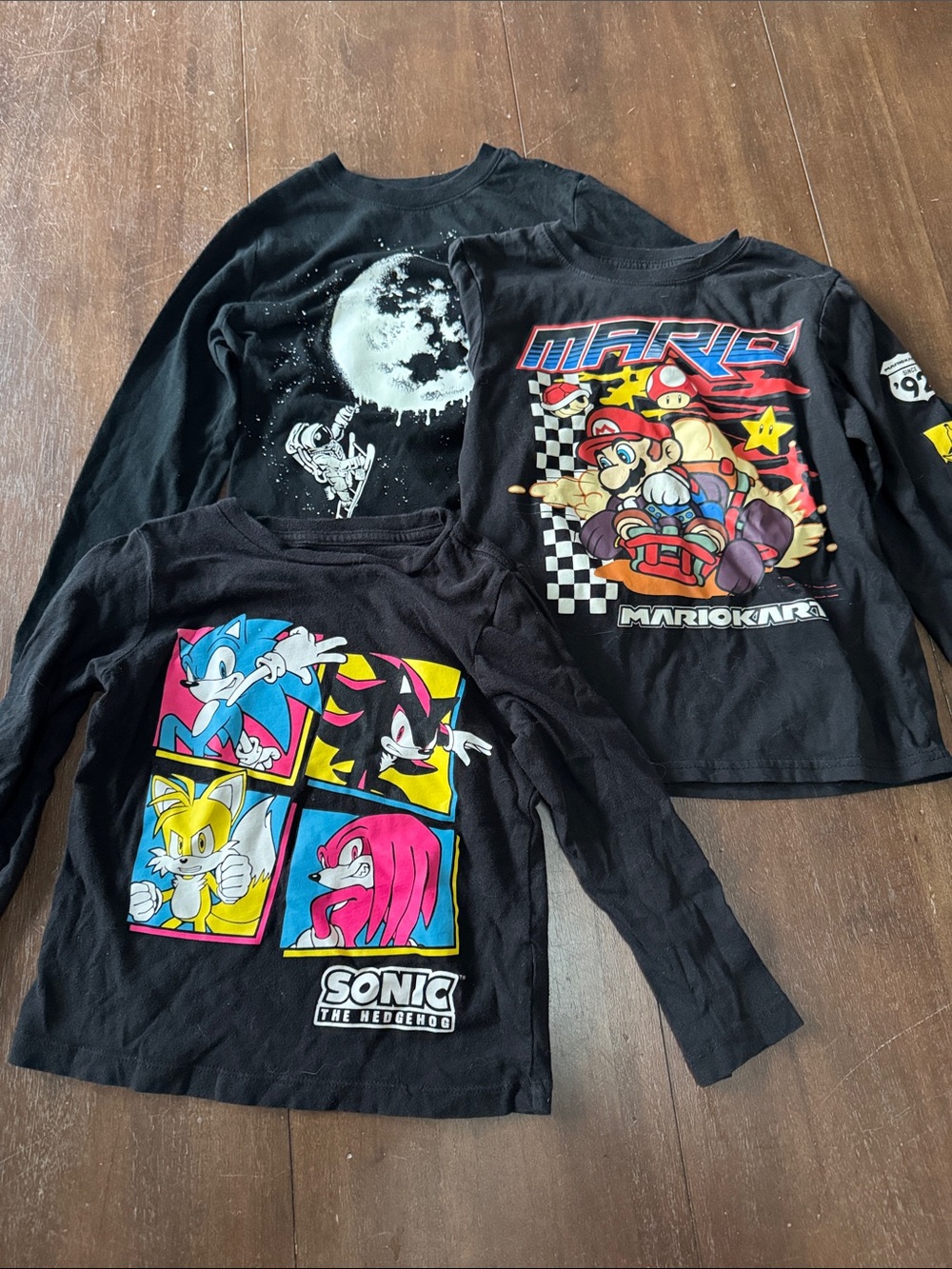 Three long sleeve boys shirts (one glows in the dark.)